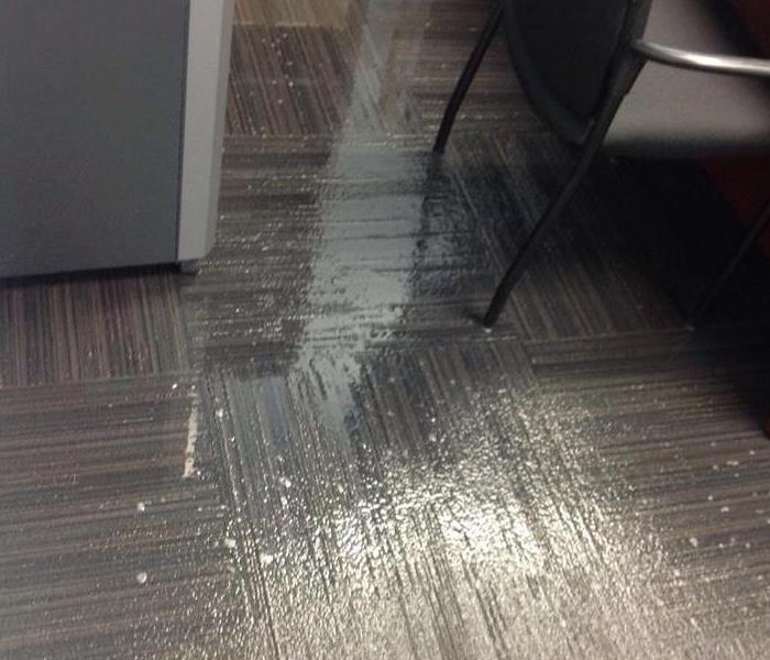 Water damage in office with carpet