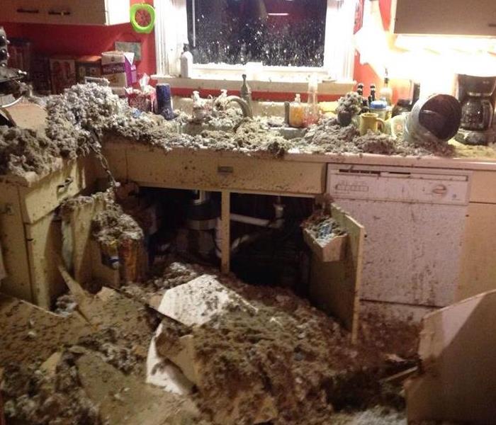 Damage from ceiling collapse in kitchen