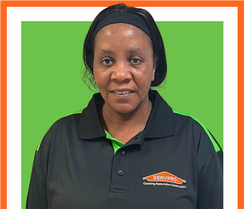servpro employee against a green and white background, woman